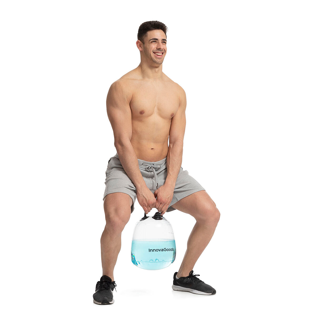 Watergevulde kettlebell voor fitnesstraining met oefengids